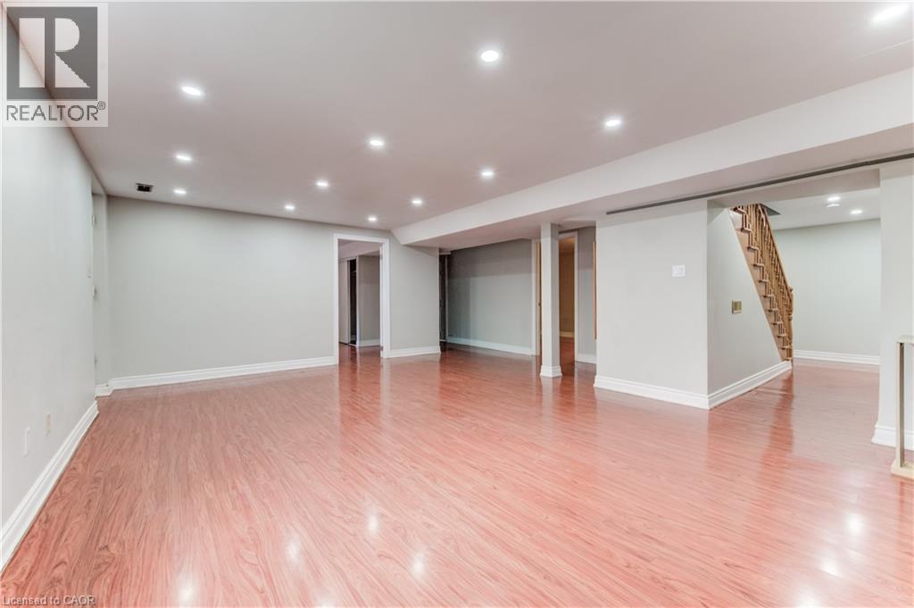 Unfurnished living room with recessed lighting, light wood-type flooring, and stairway - 685 Briardean Road Unit# Lower, Cambridge, ON - Indoor