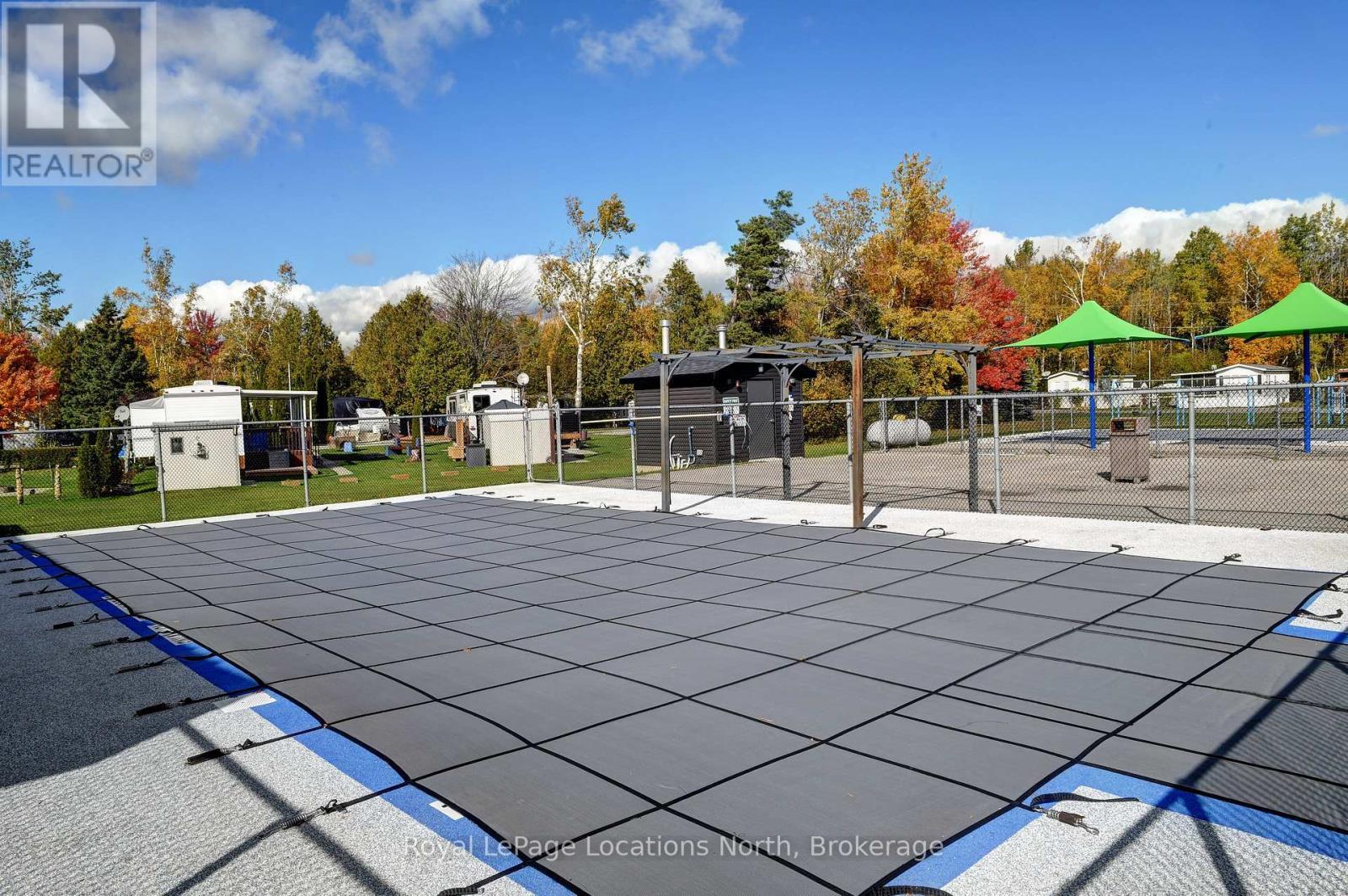 8 Prince Edward Drive, Springwater, ON - Outdoor With In Ground Pool