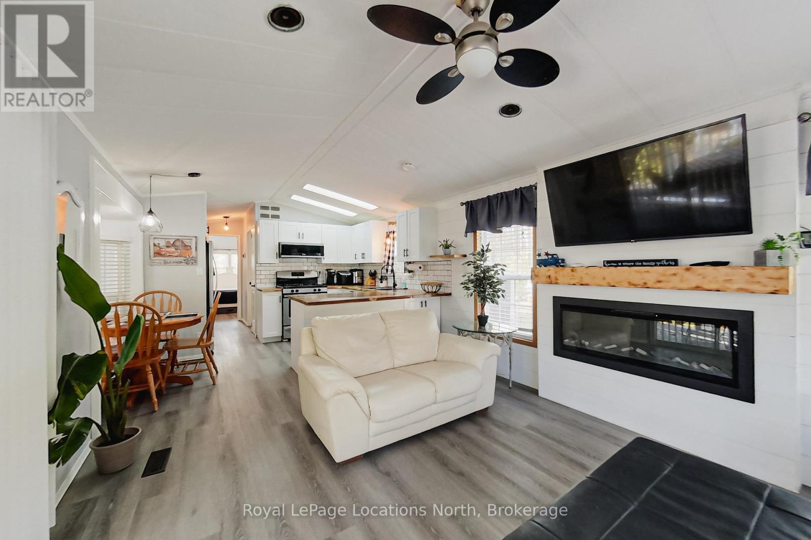 8 Prince Edward Drive, Springwater, ON - Indoor Photo Showing Living Room With Fireplace