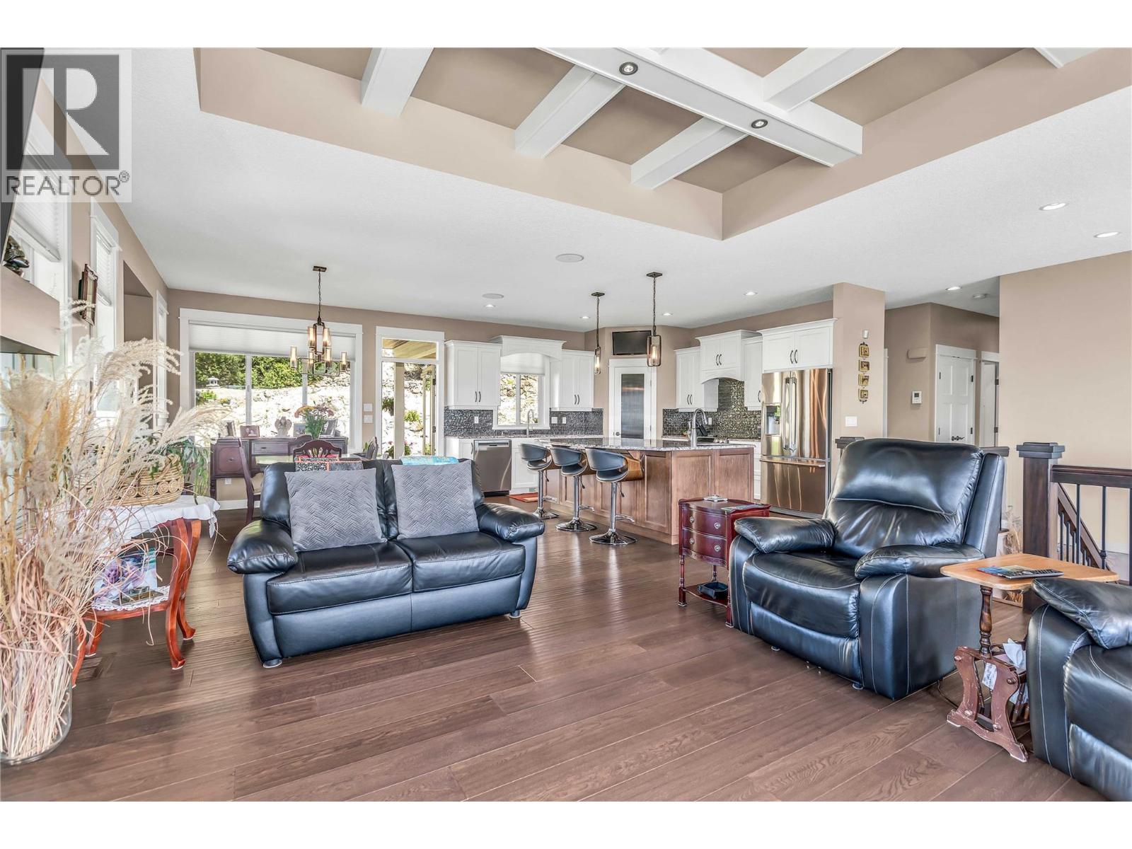 Open Concept - 8780 Braeburn Drive, Coldstream, BC - Indoor Photo Showing Living Room
