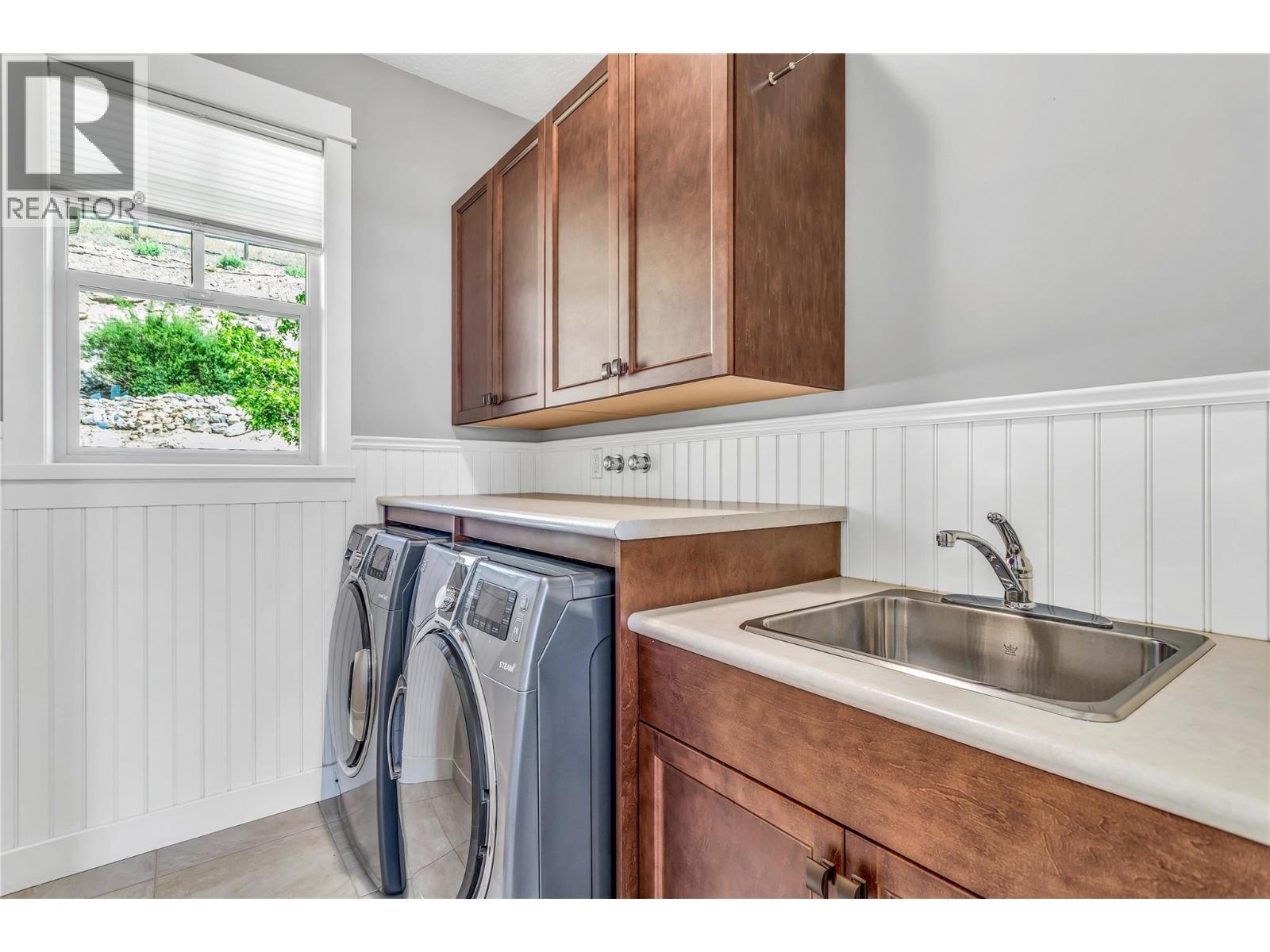 Laundry On Second Level - 8780 Braeburn Drive, Coldstream, BC - Indoor Photo Showing Laundry Room