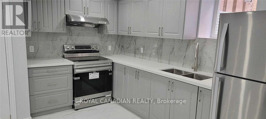 Bsmt - 84 Masters Green Crescent, Brampton, ON - Indoor Photo Showing Kitchen With Double Sink