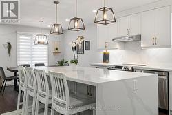 Stylish kitchen with Quartz counters -