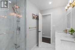 Tile shower with glass doors -