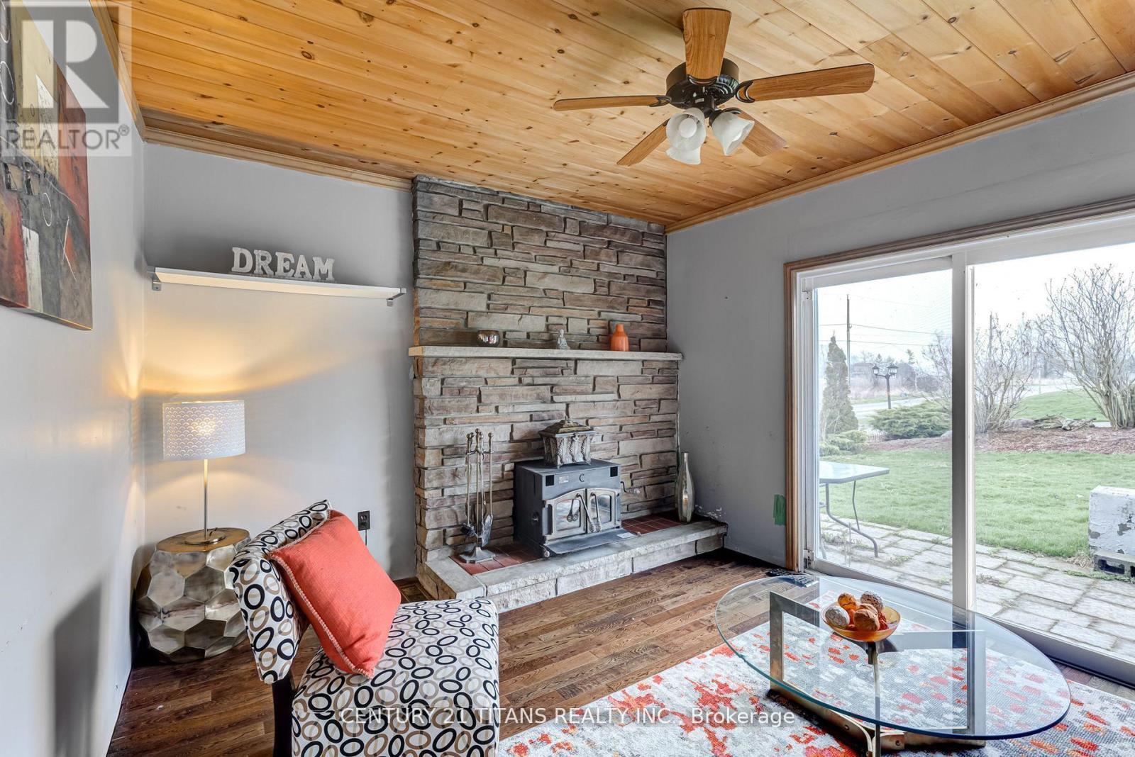 130 West Beach Road, Clarington, ON - Indoor Photo Showing Living Room With Fireplace