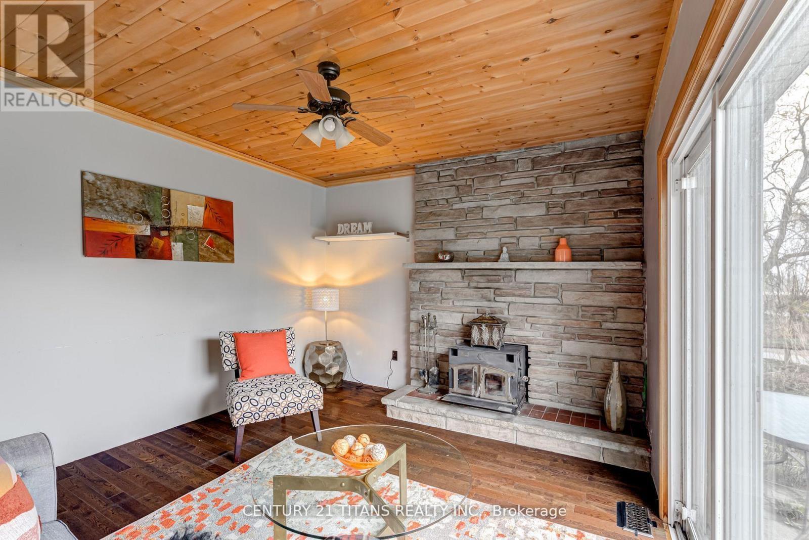130 West Beach Road, Clarington, ON - Indoor Photo Showing Living Room With Fireplace