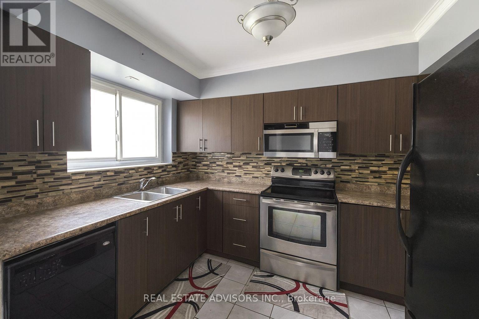 65 Moncrieff Drive, Toronto, ON - Indoor Photo Showing Kitchen With Double Sink