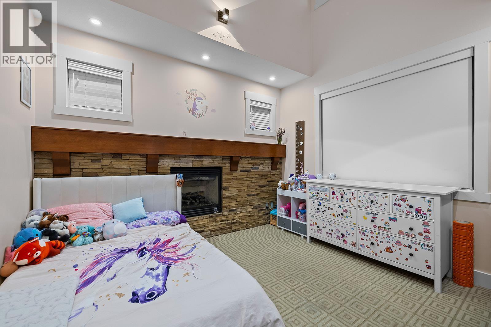408 Quilchena Crescent, Kelowna, BC - Indoor Photo Showing Bedroom With Fireplace
