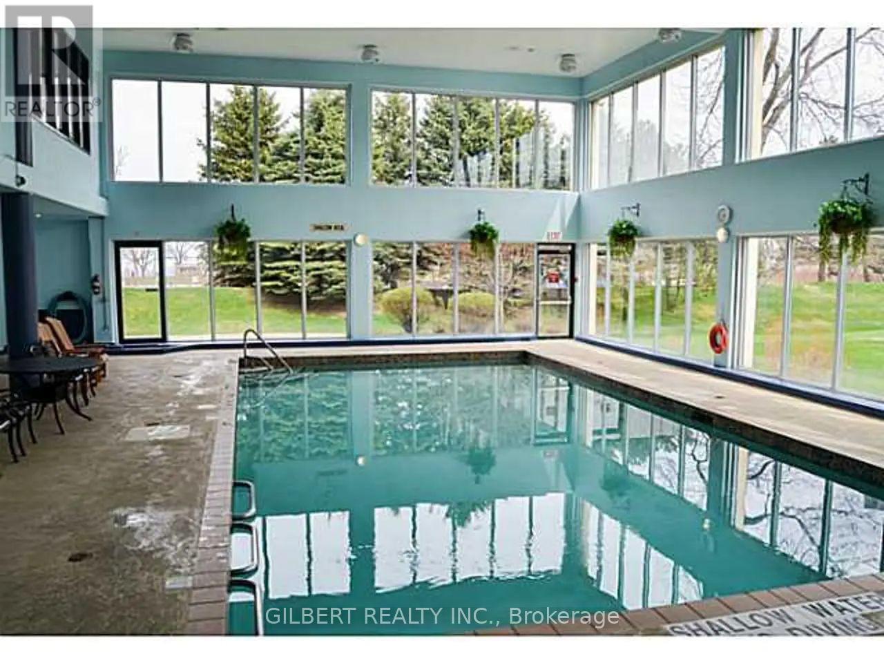 1201 - 65 Ellen Street, Barrie, ON - Indoor Photo Showing Other Room With In Ground Pool