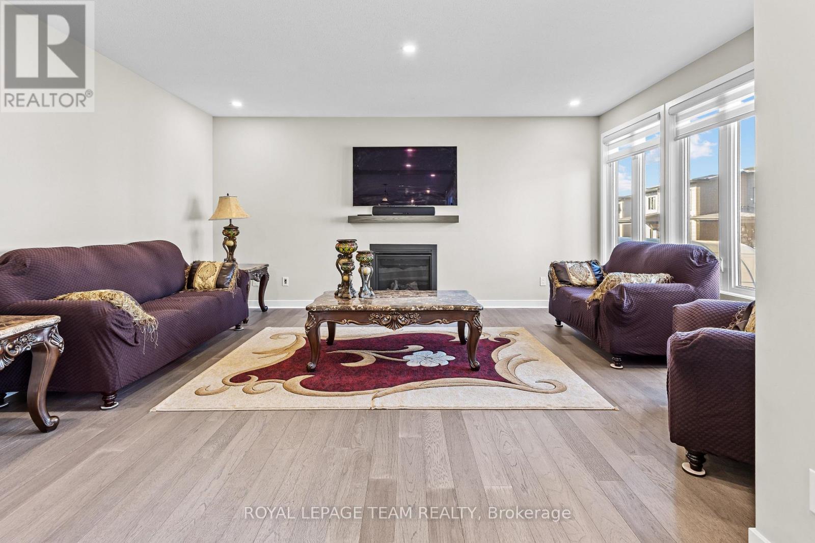 28 Dun Skipper Drive, Ottawa, ON - Indoor Photo Showing Living Room With Fireplace