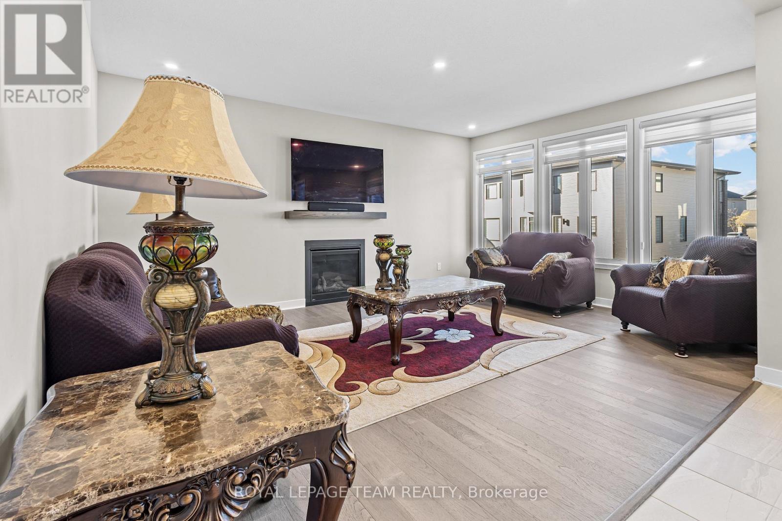28 Dun Skipper Drive, Ottawa, ON - Indoor Photo Showing Living Room With Fireplace