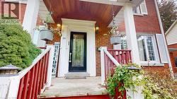 View of exterior entry with brick siding -