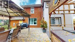 Deck featuring grilling area, outdoor dining space, and a gazebo -