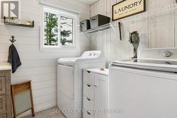 Primary bathroom with laundry -
