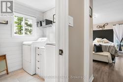 Primary bathroom with laundry -