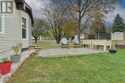 Back outdoor living with garden boxes included -