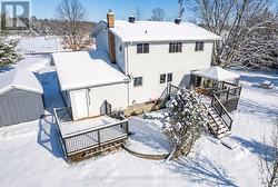 Large back deck overlooks professional landscape -