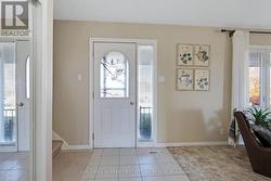 Welcoming entry; glass panel lets sun shine inside -