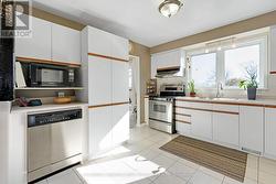 White bright kitchen with ceramic floor -