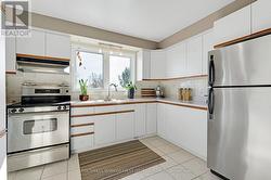 Kitchen overlooks backyard gardens & countryside -