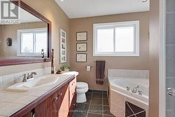 Second floor 4-pc bathroom with heated slate floor -