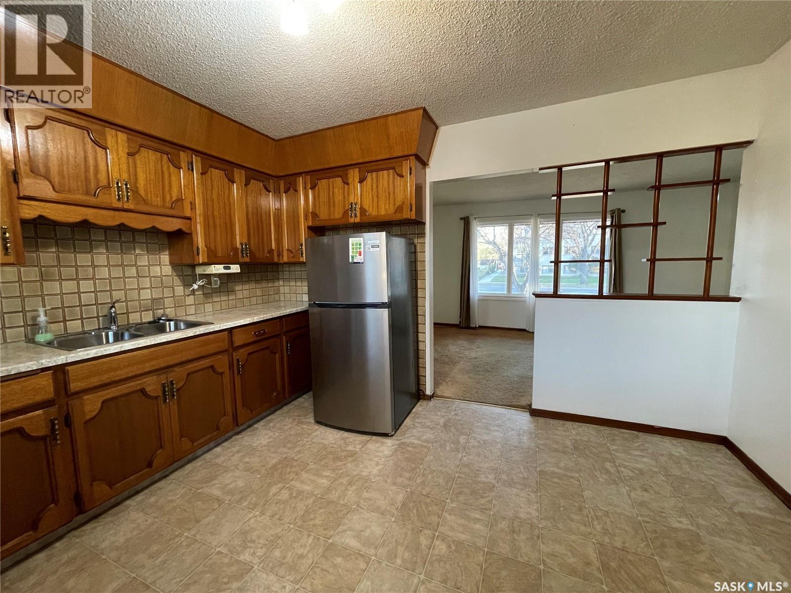 2910 Avonhurst Drive, Regina, SK - Indoor Photo Showing Kitchen With Double Sink