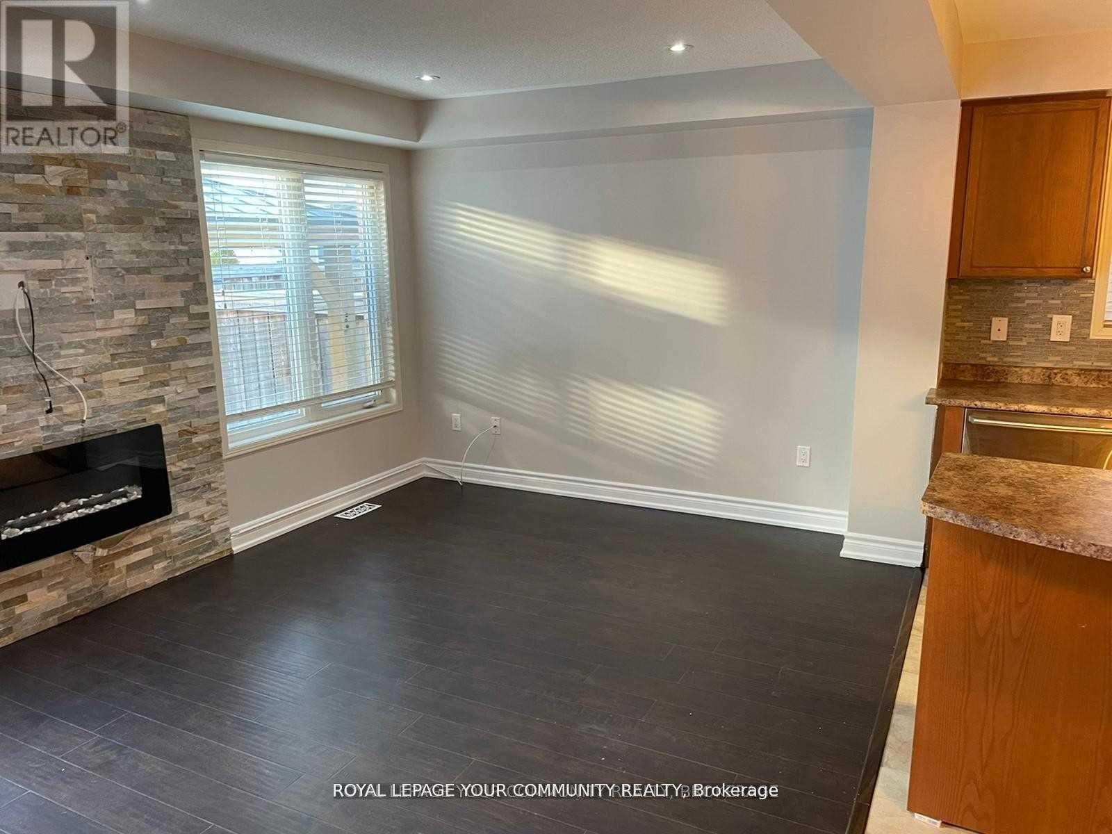 122 Russel Drive, Bradford West Gwillimbury, ON - Indoor Photo Showing Other Room With Fireplace