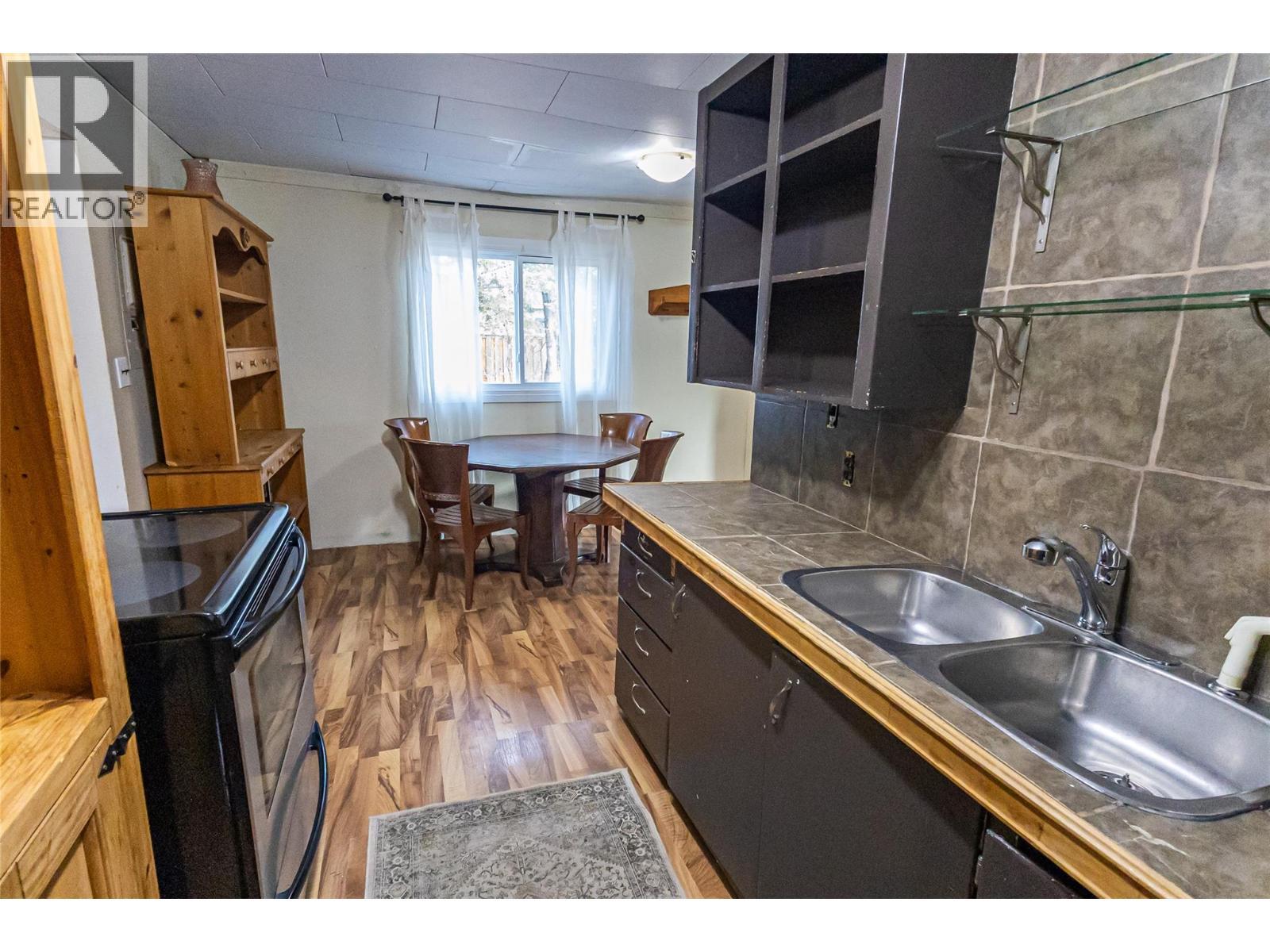 4912 47 Avenue, Pouce Coupe, BC - Indoor Photo Showing Kitchen With Double Sink