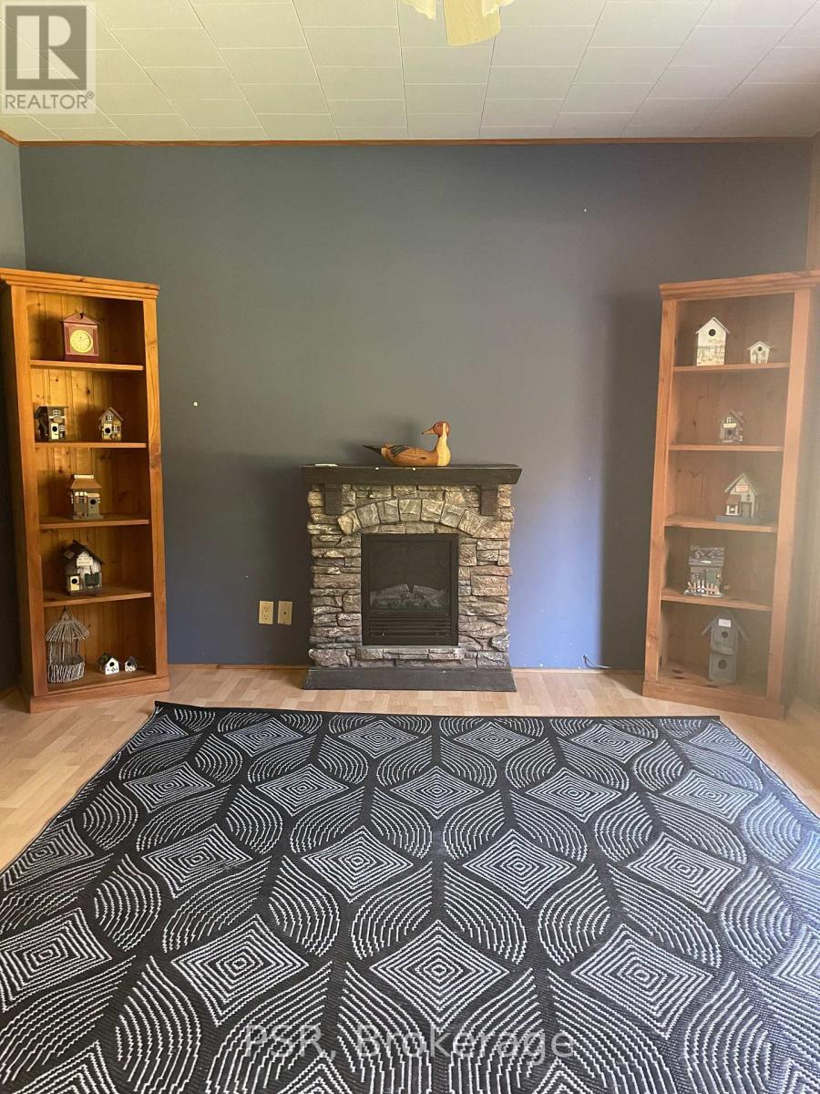 1094 Morinus Road, Muskoka Lakes (Medora), ON - Indoor With Fireplace