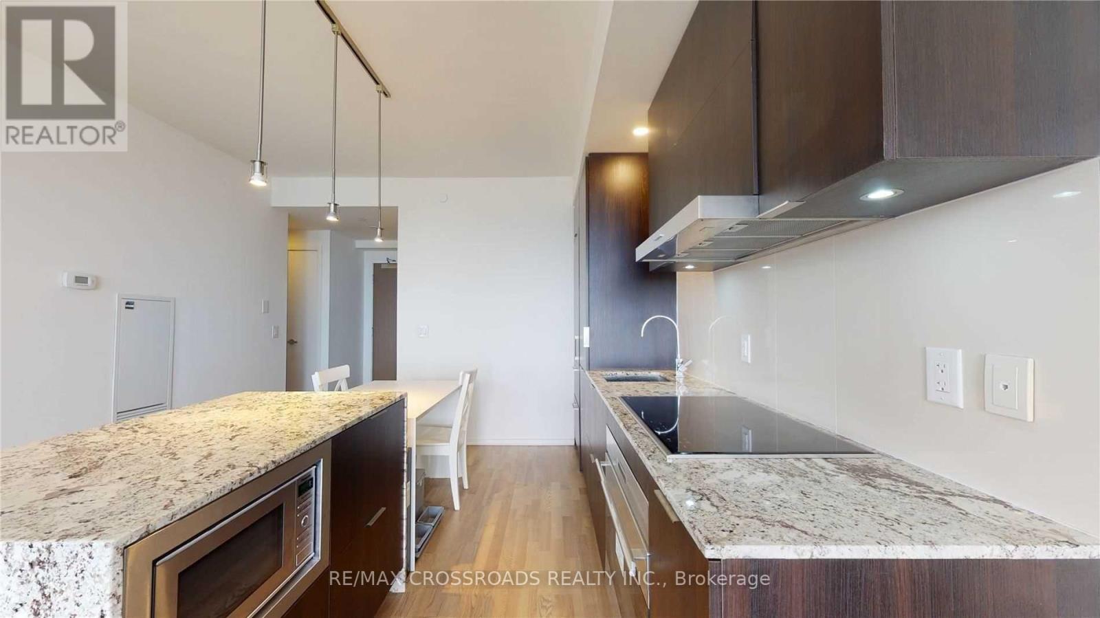 Wolf Cooktop and Stove /Subzero B/I Fridge - 5010 - 1 Bloor Street E, Toronto, ON - Indoor Photo Showing Kitchen With Upgraded Kitchen