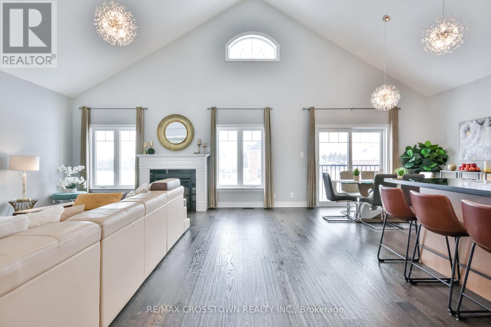 22 Stewart Crescent, Essa, ON - Indoor Photo Showing Living Room With Fireplace