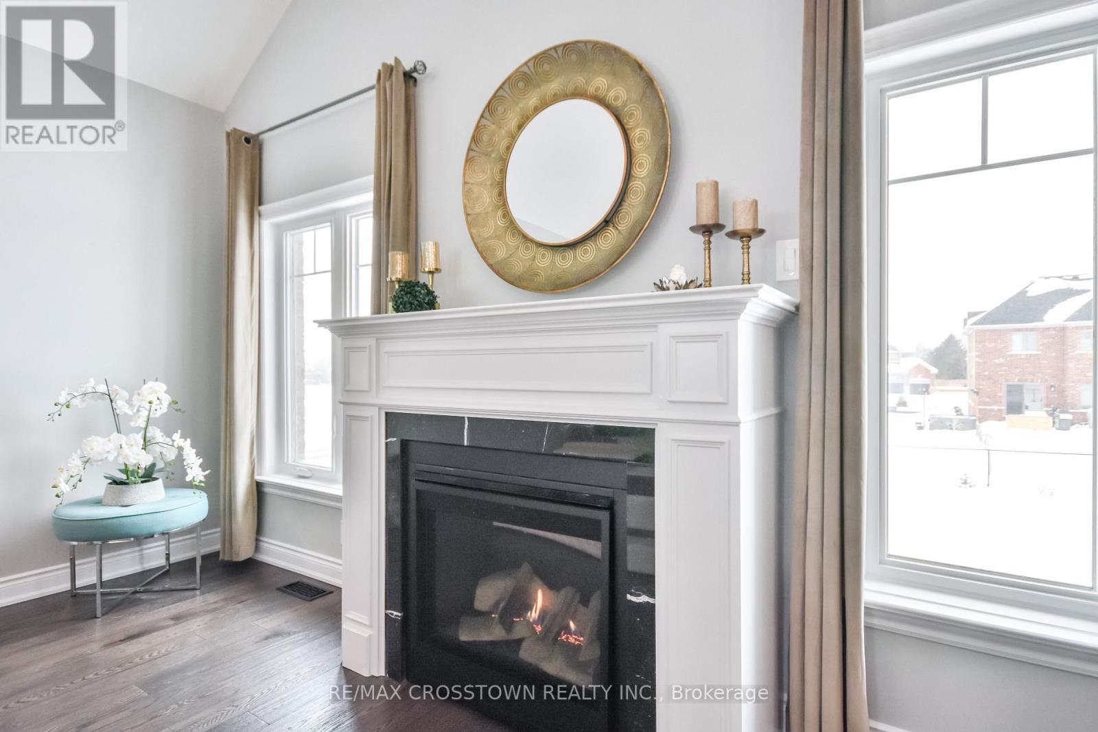 22 Stewart Crescent, Essa, ON - Indoor Photo Showing Living Room With Fireplace