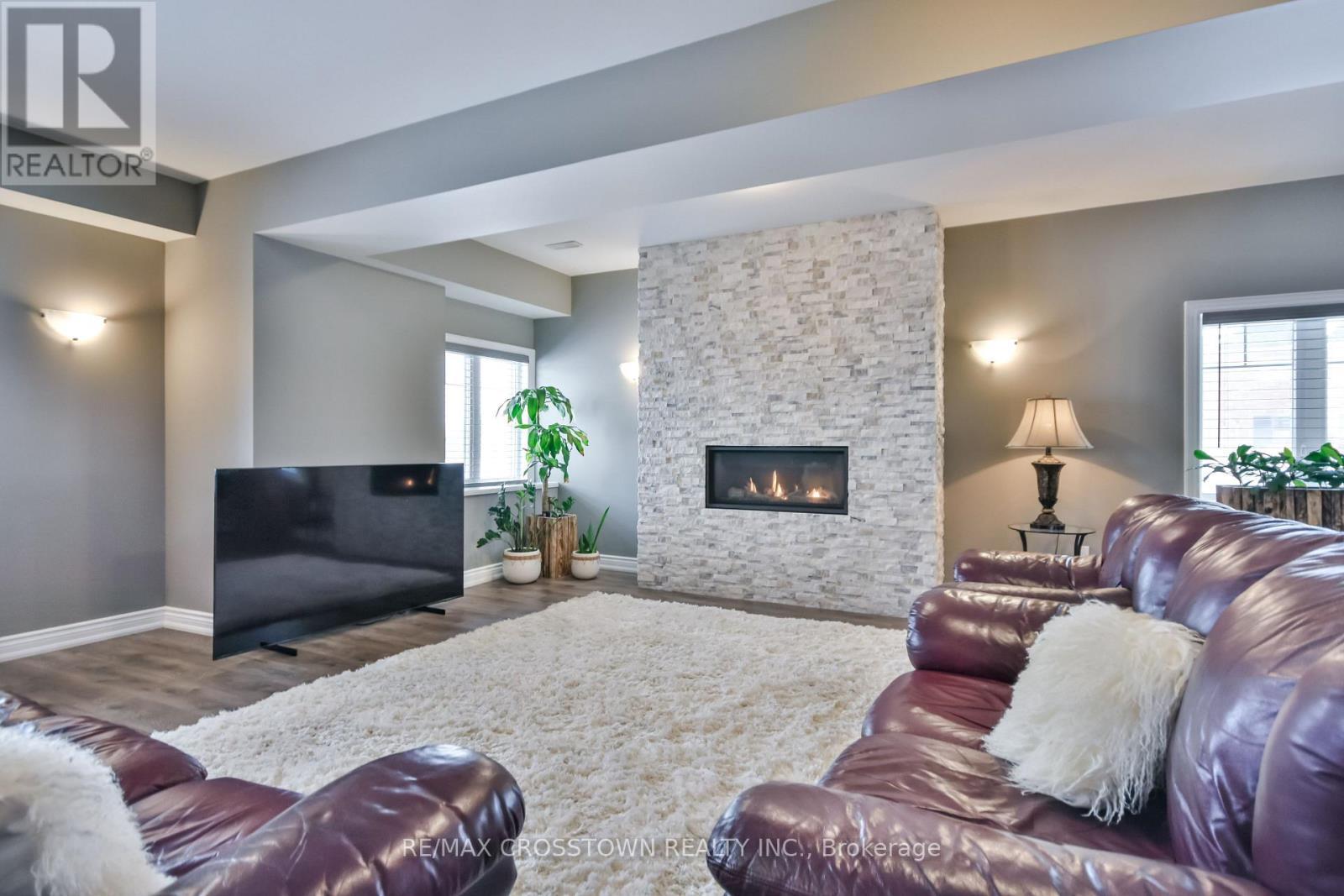 22 Stewart Crescent, Essa, ON - Indoor Photo Showing Living Room With Fireplace