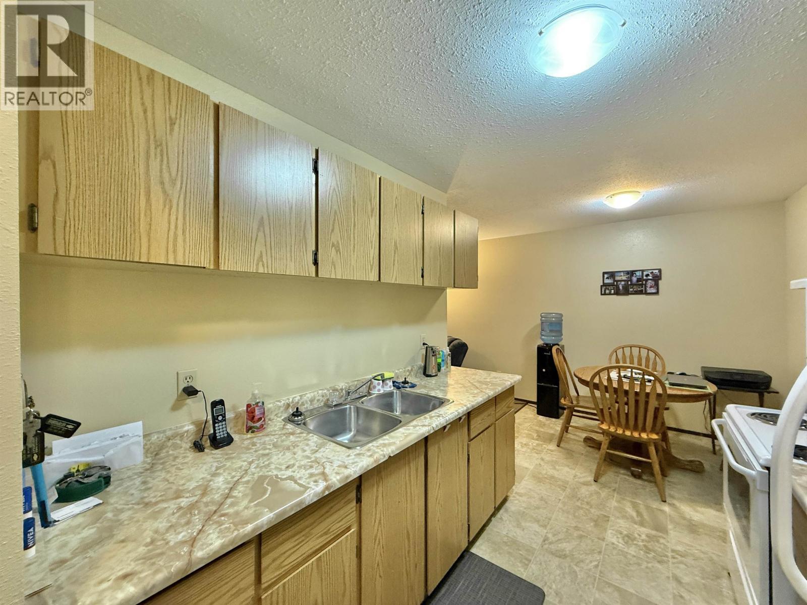 203 625 Reid Street, Quesnel, BC - Indoor Photo Showing Kitchen With Double Sink
