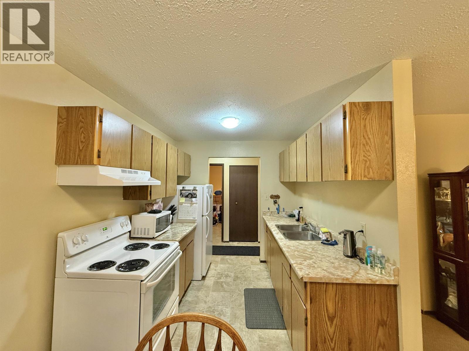 203 625 Reid Street, Quesnel, BC - Indoor Photo Showing Kitchen With Double Sink