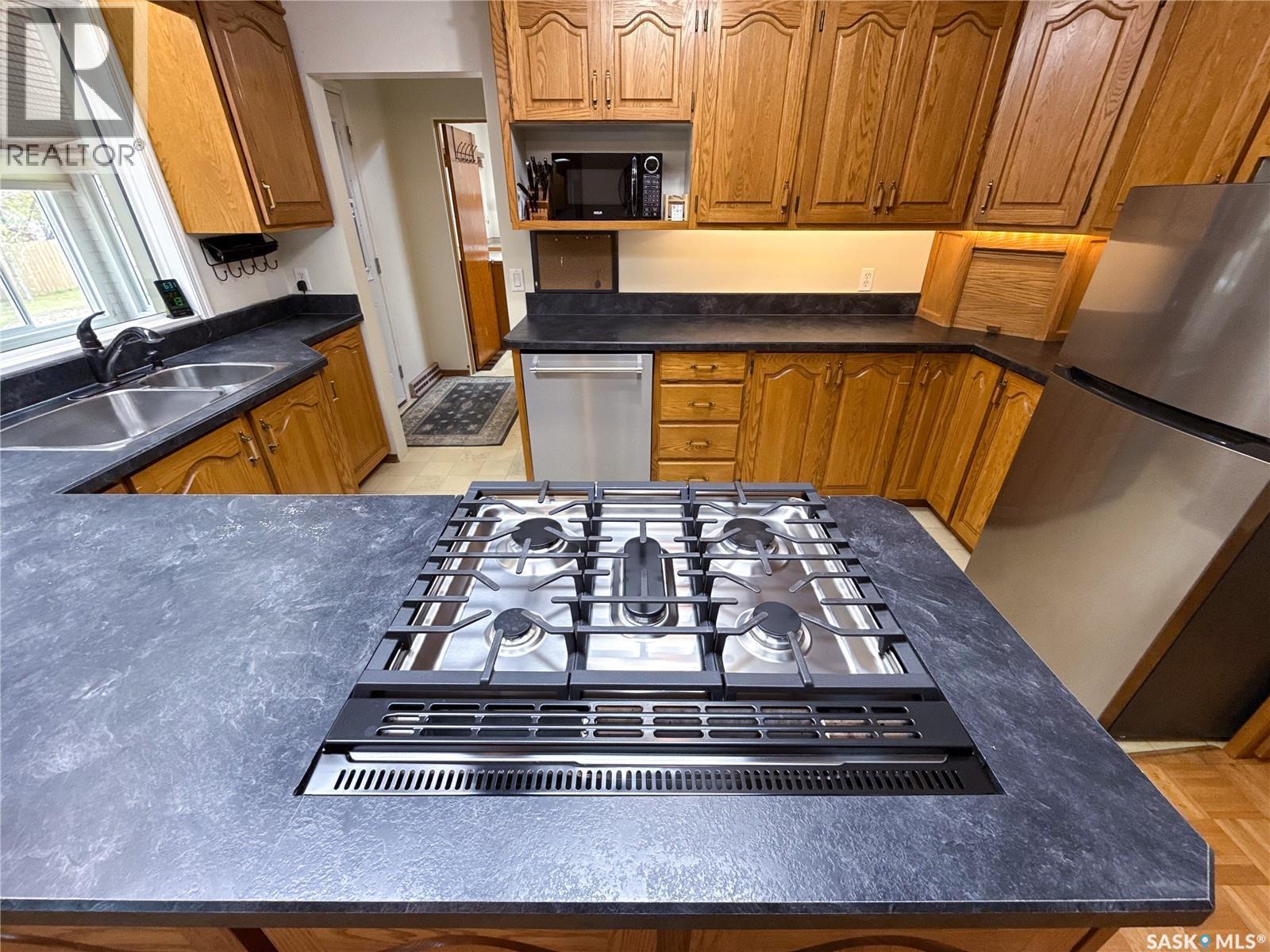 220 1St Street W, Ponteix, SK - Indoor Photo Showing Kitchen With Double Sink
