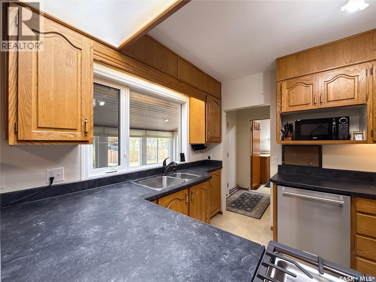 220 1St Street W, Ponteix, SK - Indoor Photo Showing Kitchen With Double Sink