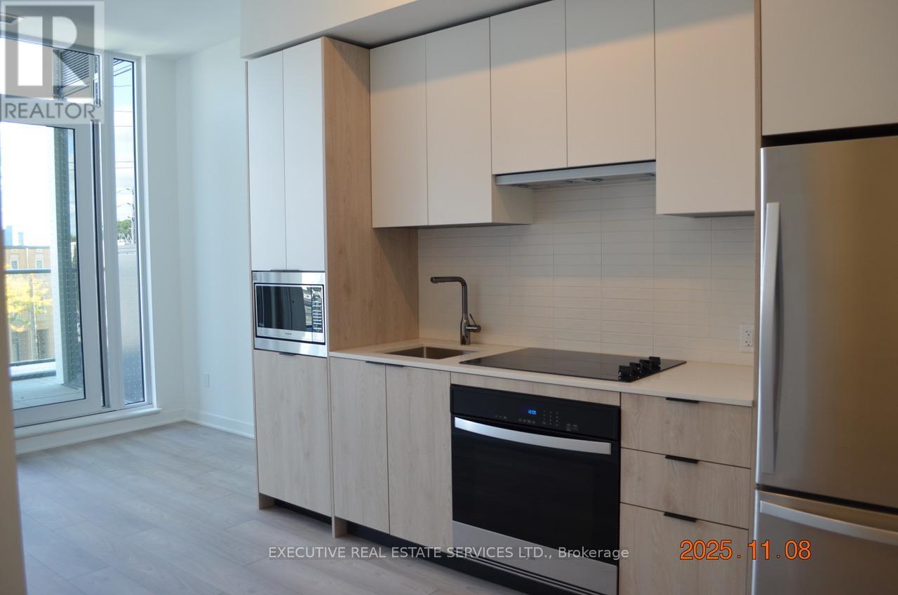 219 - 1007 The Queensway W, Toronto, ON - Indoor Photo Showing Kitchen With Stainless Steel Kitchen With Upgraded Kitchen