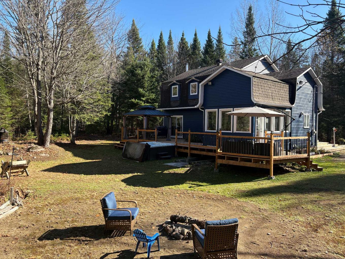 Back facade - 4760 Ch. De La Doncaster, Sainte-Adèle, QC - Outdoor With Deck Patio Veranda