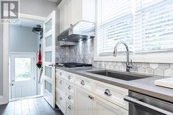 Kitchen to Basement and Mudroom off Garage -