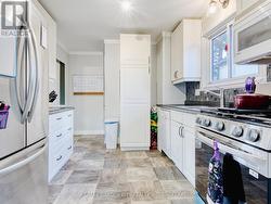 Eat in kitchen with stainless appliances -