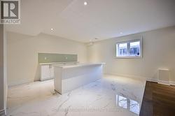 basement recreation room with large window -