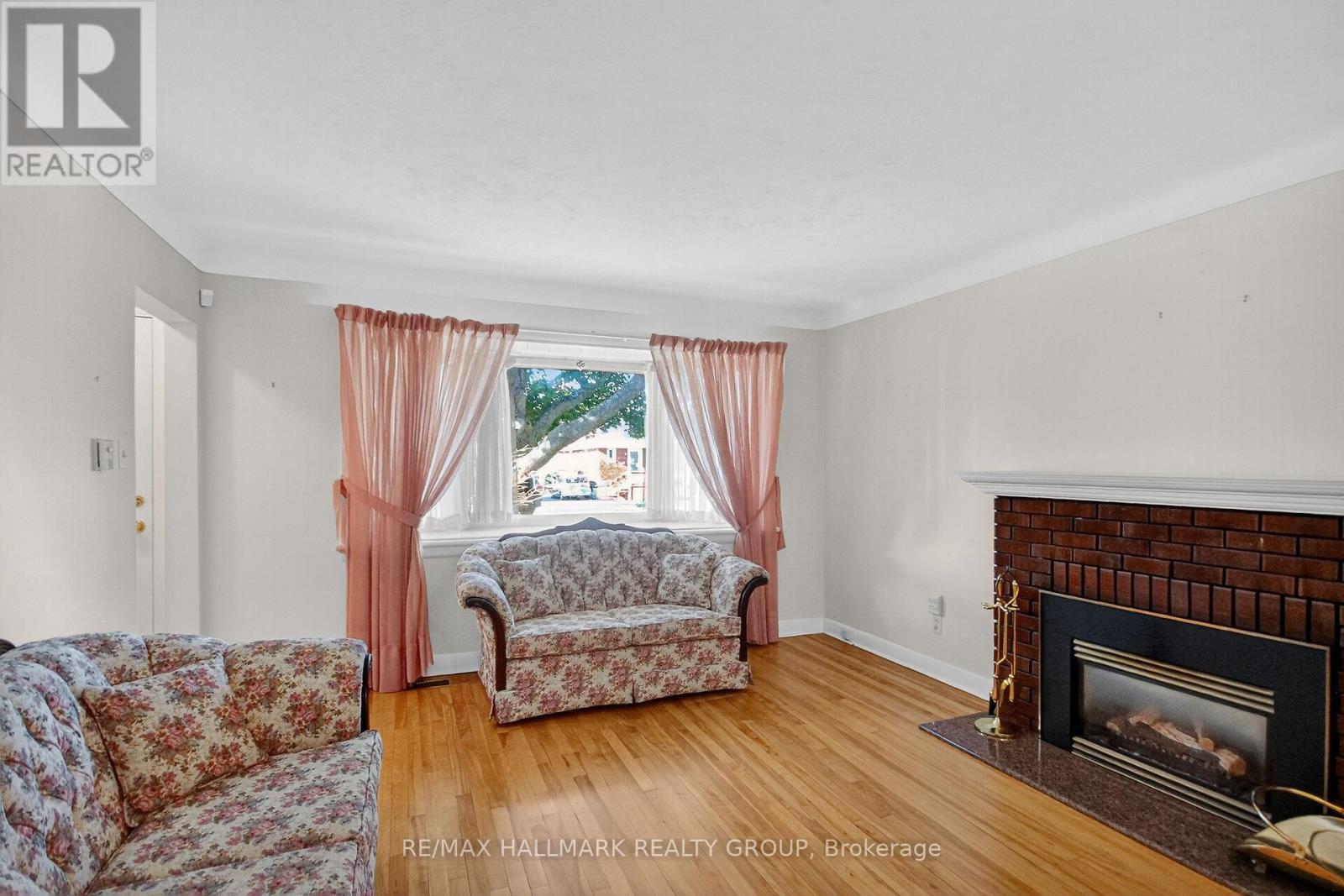 1281 Erindale Drive, Ottawa, ON - Indoor Photo Showing Living Room With Fireplace