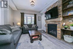 Living room, gas fireplace, wood mantle, Stone hrt -