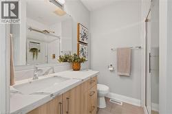 Bathroom with vanity and a shower stall -
