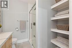 Full bathroom with a shower stall and vanity -