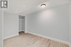 Unfurnished bedroom with light wood-style floors, a closet, and recessed lighting -
