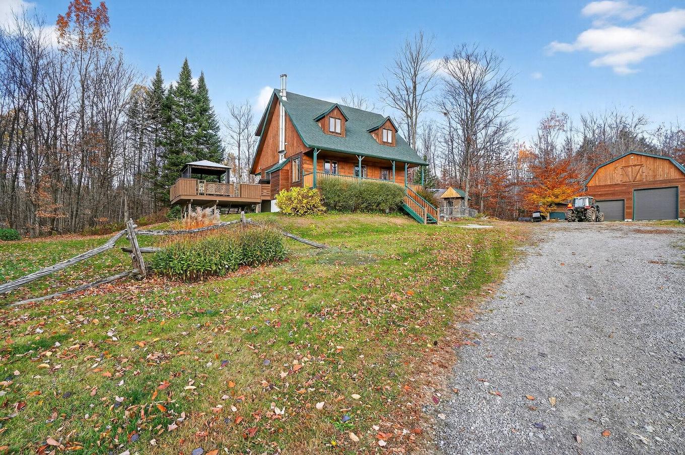 Façade - 580Z Ch. De La Carrière, Saint-Hippolyte, QC - Outdoor With Deck Patio Veranda