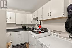 Large laundry room with storage. -