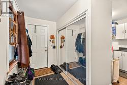 Foyer with closet and access to the garage. -